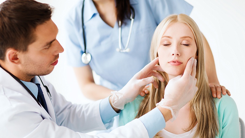 An oral cancer examination extends beyond the mouth to face, neck and head.