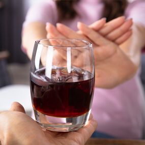 Drinking alcohol dries out your mouth and contains acids that attack your teeth.